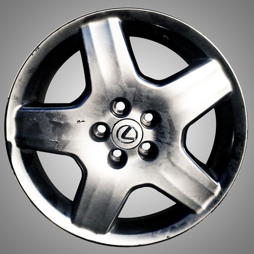 Lexus wheel before repair — showing curb rash and damage