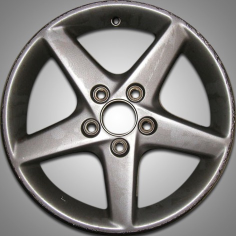 Porsche wheel before refinishing — scratched and scuffed